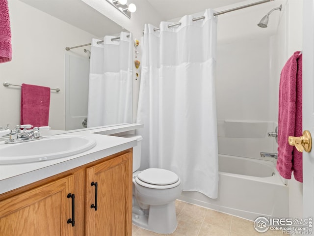 full bath with vanity, shower / bath combo with shower curtain, tile patterned flooring, and toilet