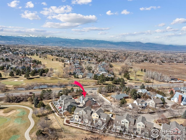 birds eye view of property featuring a mountain view, golf course view, and a residential view