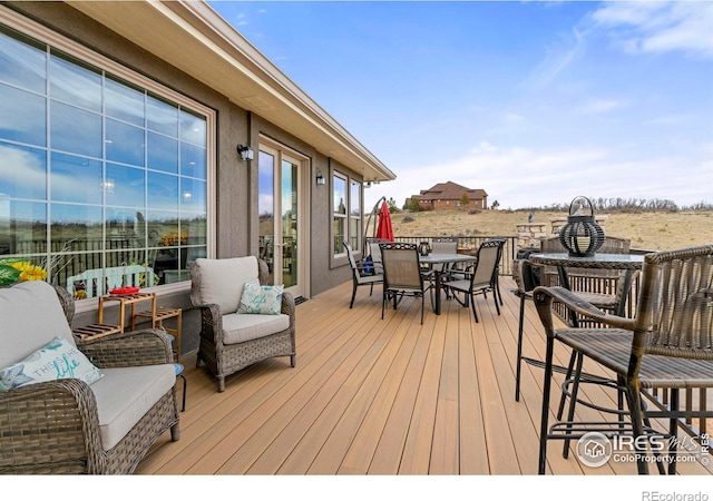 deck featuring outdoor dining space