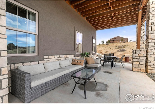 view of patio featuring outdoor dining space and an outdoor hangout area