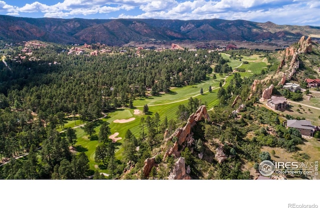 drone / aerial view featuring a mountain view and view of golf course