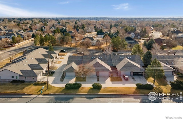 birds eye view of property with a residential view