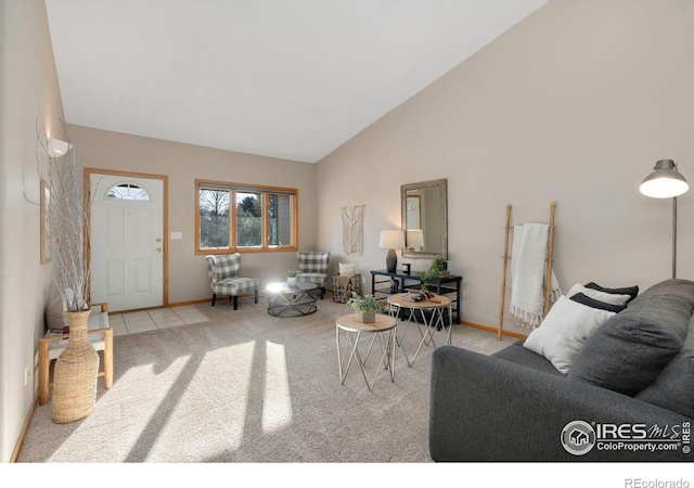 carpeted living room featuring high vaulted ceiling and baseboards