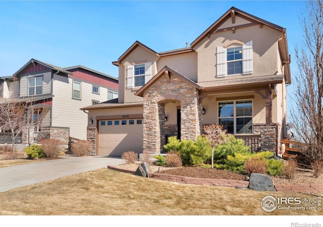 view of front of property featuring a garage, stone siding, driveway, and stucco siding