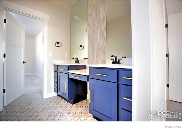 bathroom featuring vanity and baseboards