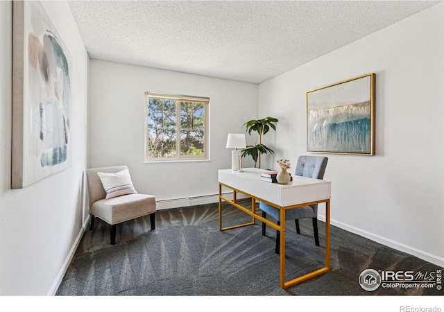 office area featuring a textured ceiling, carpet floors, baseboard heating, and baseboards