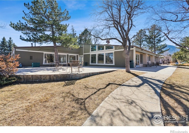 back of house with a patio area