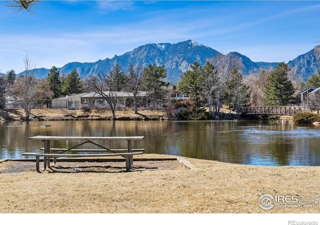 exterior space featuring a water and mountain view