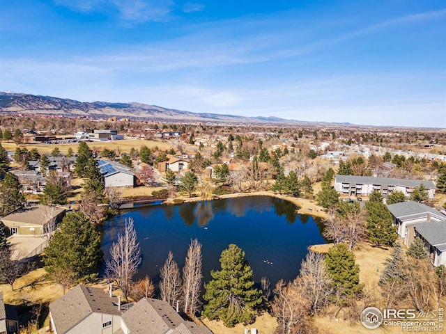 aerial view featuring a water and mountain view and a residential view