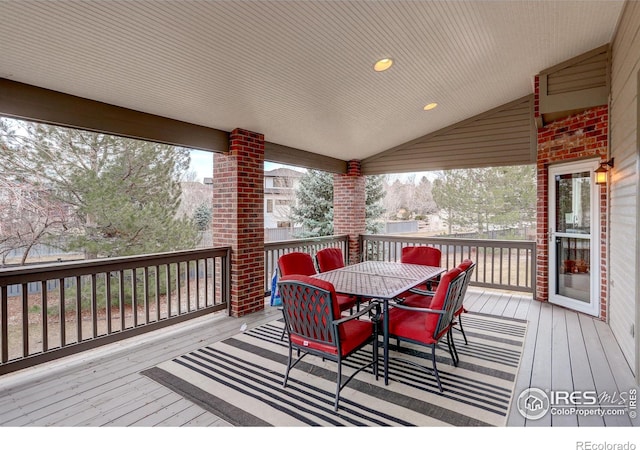 wooden deck featuring outdoor dining space