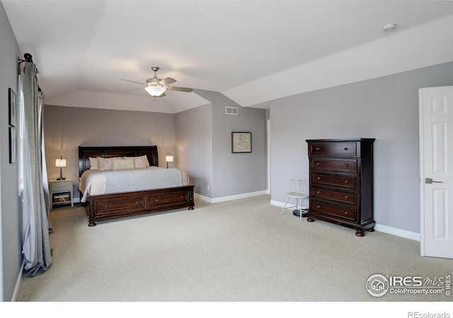 bedroom with carpet, visible vents, a ceiling fan, vaulted ceiling, and baseboards