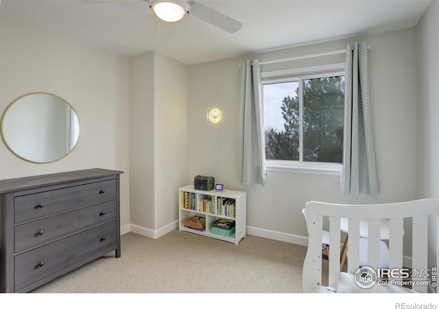 bedroom with baseboards, a ceiling fan, and light colored carpet