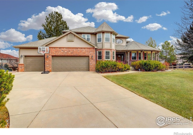 view of front of house with concrete driveway, brick siding, a front lawn, and an attached garage