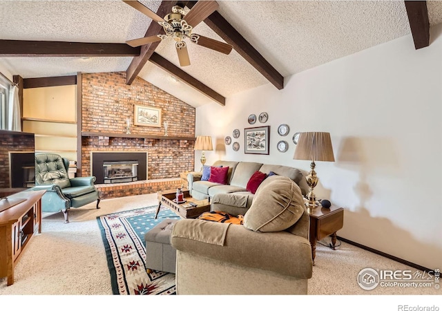 living room featuring baseboards, lofted ceiling with beams, a textured ceiling, carpet floors, and a fireplace