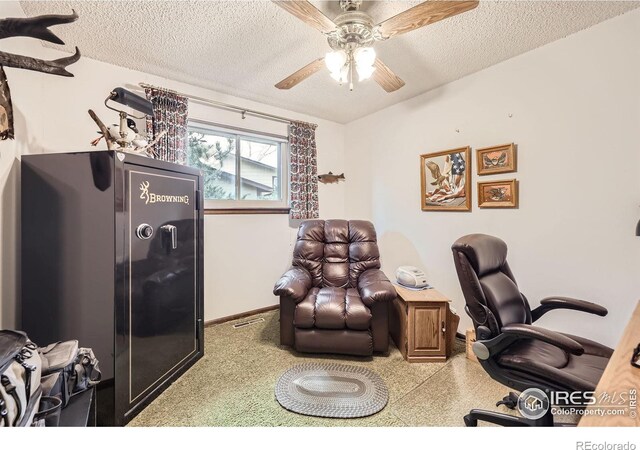 office area featuring a ceiling fan, baseboards, visible vents, and a textured ceiling