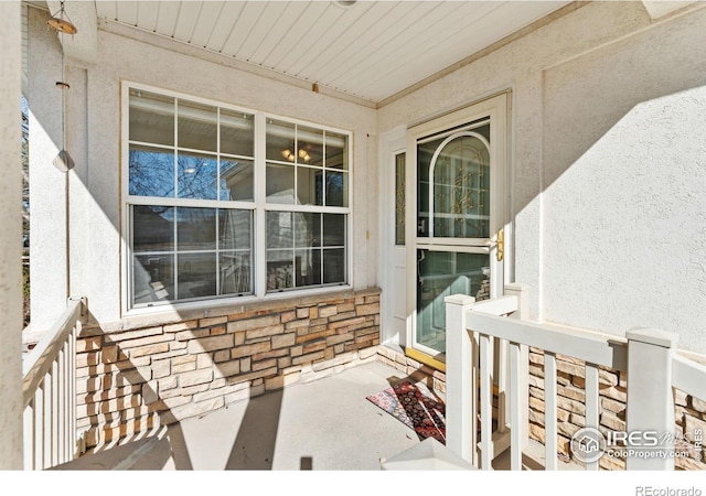 view of exterior entry featuring stone siding