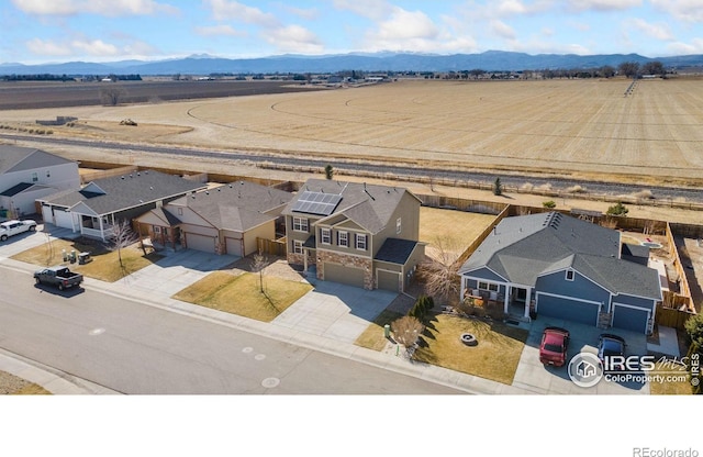 drone / aerial view with a mountain view and a residential view