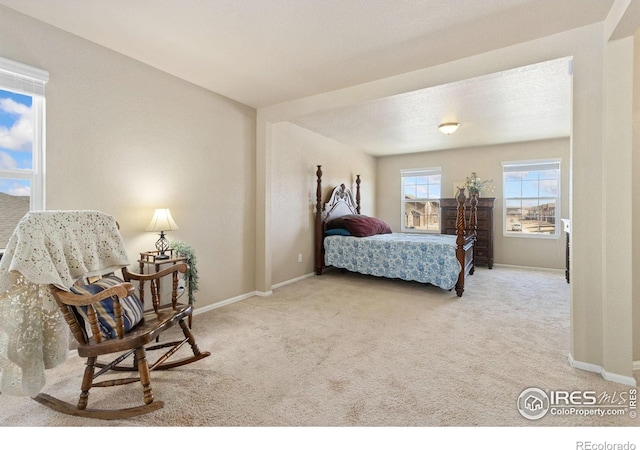 carpeted bedroom with baseboards