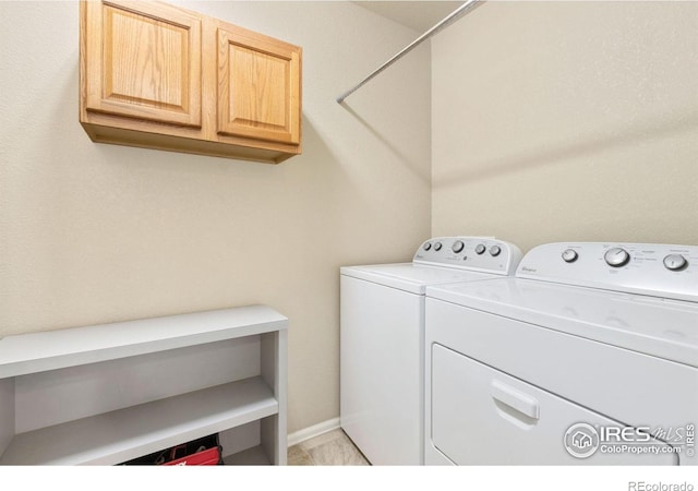 laundry area with cabinet space and washing machine and dryer