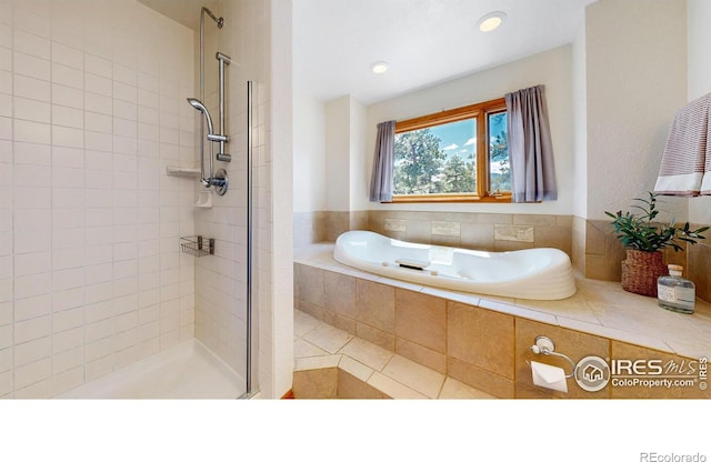 full bathroom with a bath, recessed lighting, tiled shower, and tile patterned floors