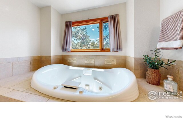 full bathroom featuring a jetted tub