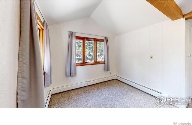 spare room featuring carpet floors, a baseboard radiator, and vaulted ceiling