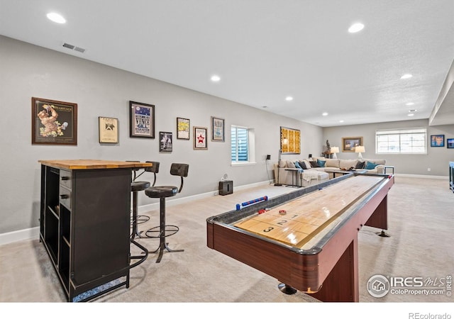 playroom featuring light carpet, visible vents, and recessed lighting