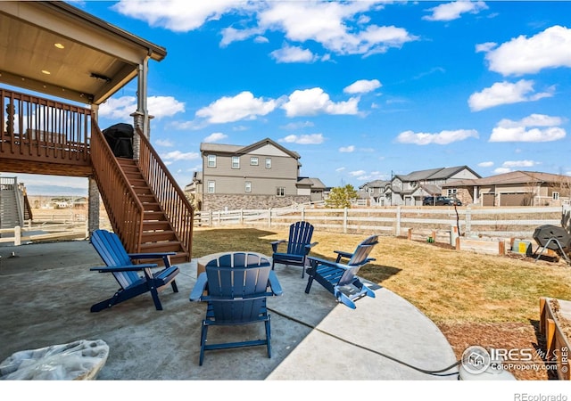 view of patio / terrace with a fenced backyard and stairs