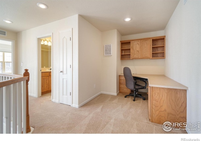 office space with recessed lighting, visible vents, light carpet, built in study area, and baseboards