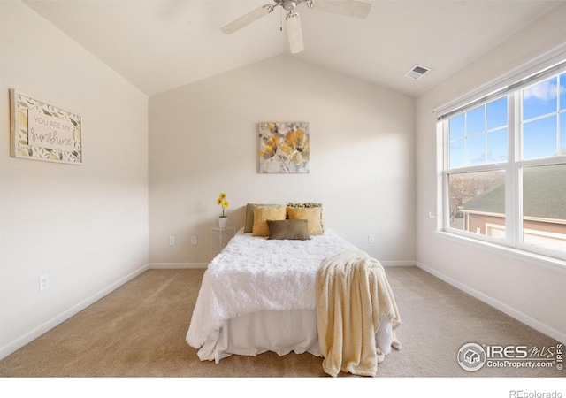 bedroom featuring lofted ceiling, carpet flooring, and baseboards