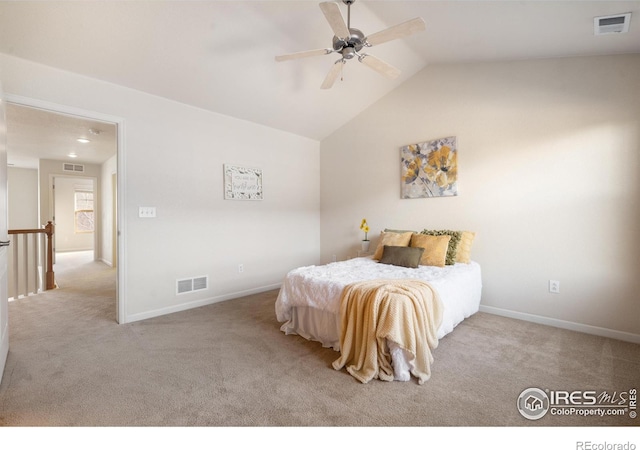 bedroom with visible vents, vaulted ceiling, and carpet flooring