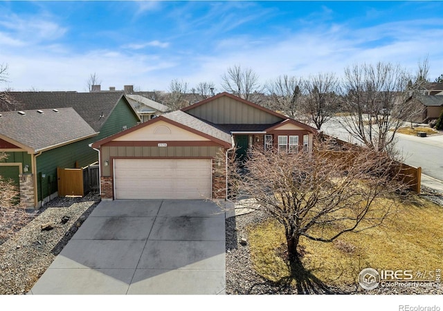 view of front of property featuring brick siding, driveway, and a garage