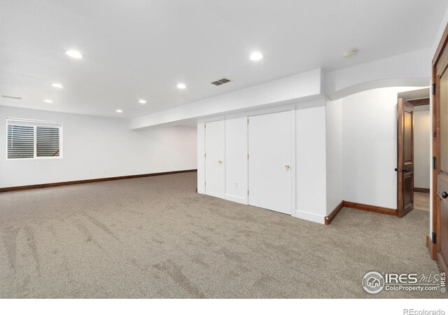 finished basement with carpet flooring, recessed lighting, visible vents, and baseboards