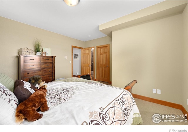 bedroom featuring carpet flooring and baseboards