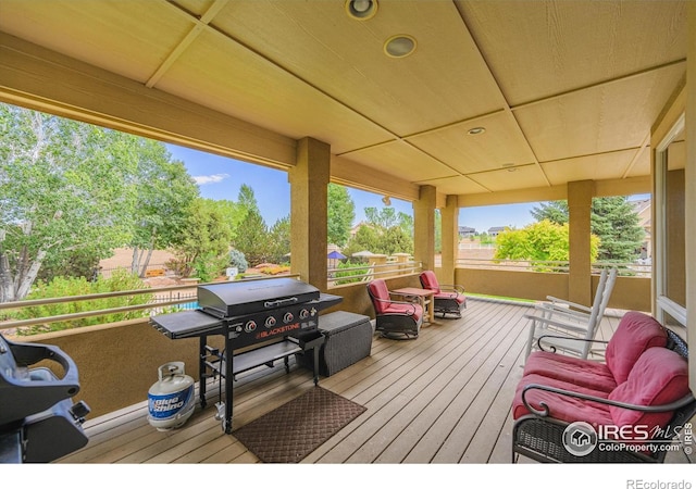 wooden terrace with area for grilling