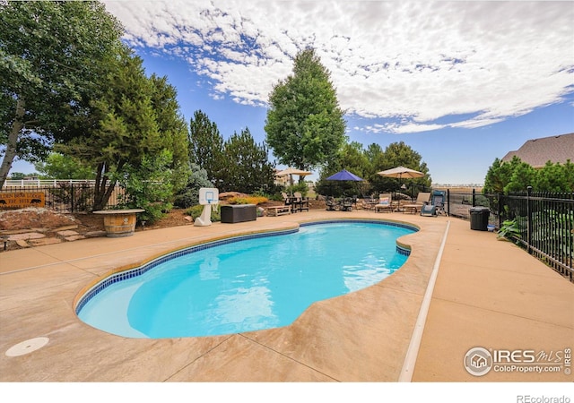 view of swimming pool with a fenced in pool, a patio area, and fence