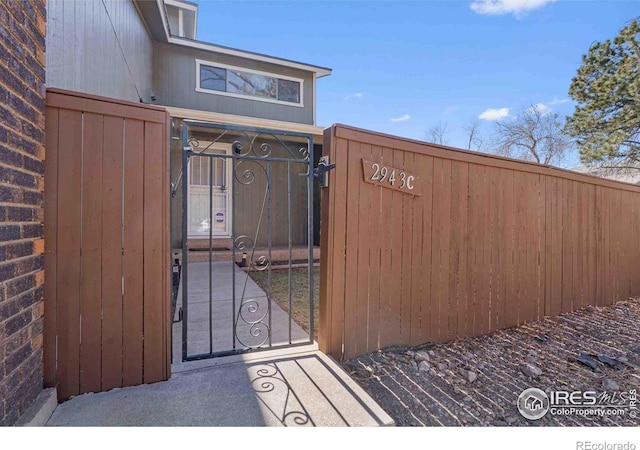 view of gate featuring fence