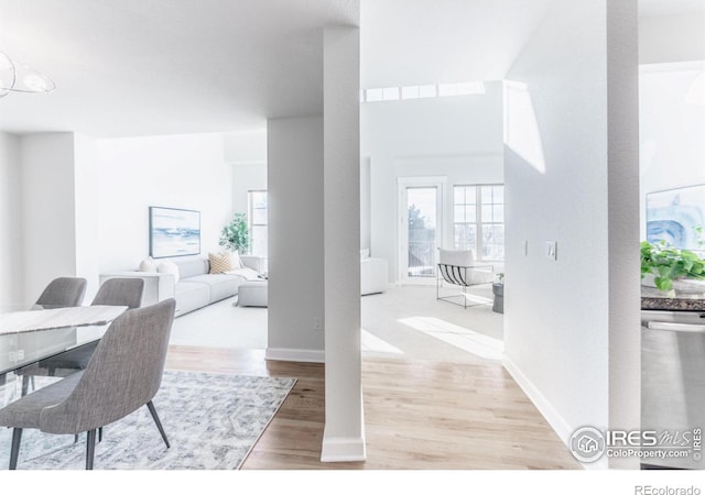 dining area featuring baseboards and wood finished floors