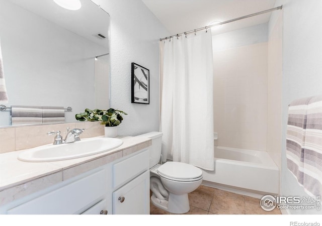 bathroom featuring tile patterned flooring, toilet, visible vents, vanity, and shower / bath combo with shower curtain