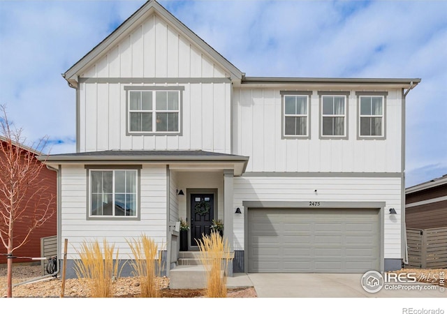 view of front of home featuring an attached garage, driveway, and board and batten siding