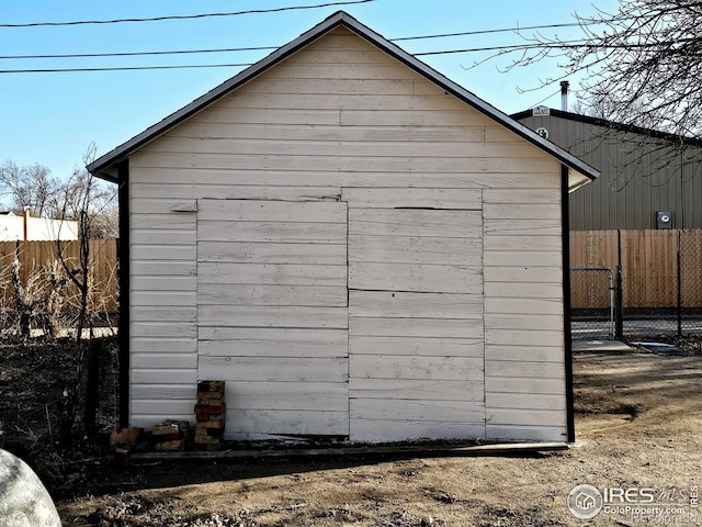 view of shed with fence