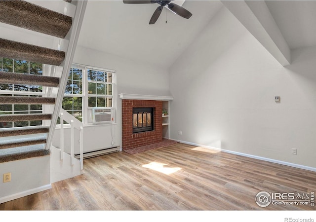 3565 Windmill Dr Unit 5, Fort Collins, CO 80526 - unfurnished living room with a baseboard radiator, high vaulted ceiling, wood finished floors, a ceiling fan, and a brick fireplace