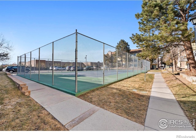 view of tennis court with fence