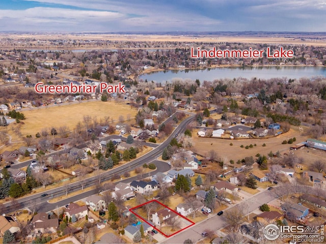 aerial view with a water view and a residential view