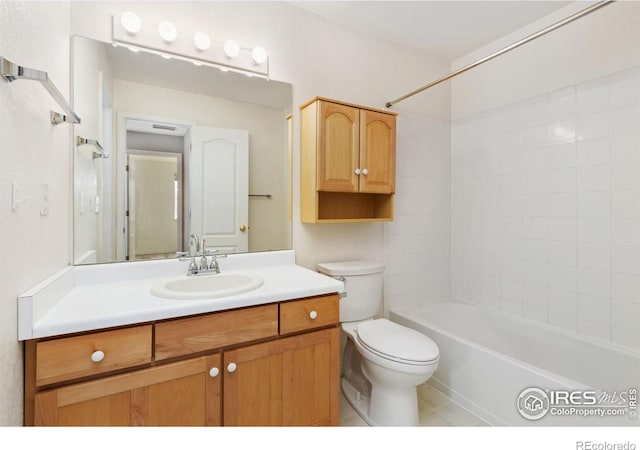 full bathroom featuring tub / shower combination, vanity, and toilet