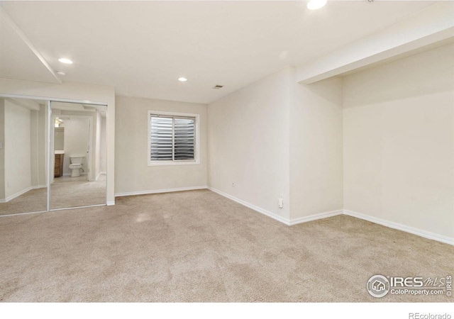 unfurnished bedroom featuring baseboards, carpet floors, and recessed lighting