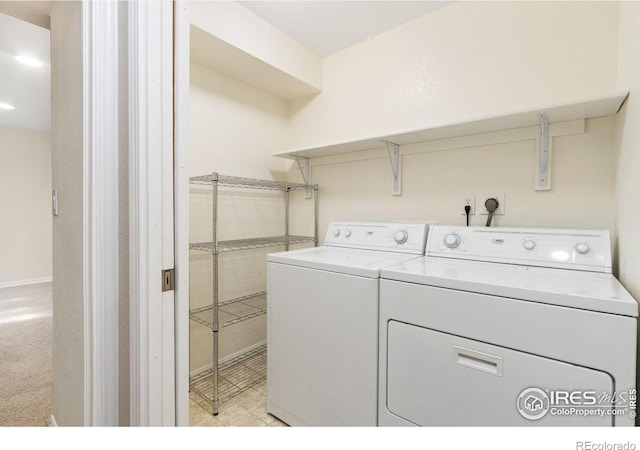 clothes washing area with laundry area and washing machine and clothes dryer