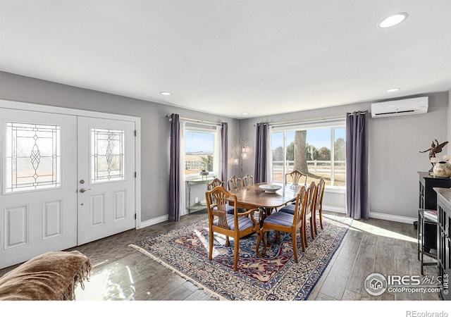 dining room featuring recessed lighting, a wall mounted air conditioner, baseboards, and wood-type flooring