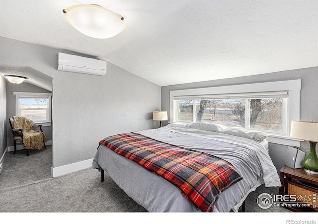 bedroom with multiple windows, lofted ceiling, a wall unit AC, and carpet floors