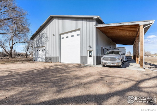 view of home's exterior with an outdoor structure and a garage